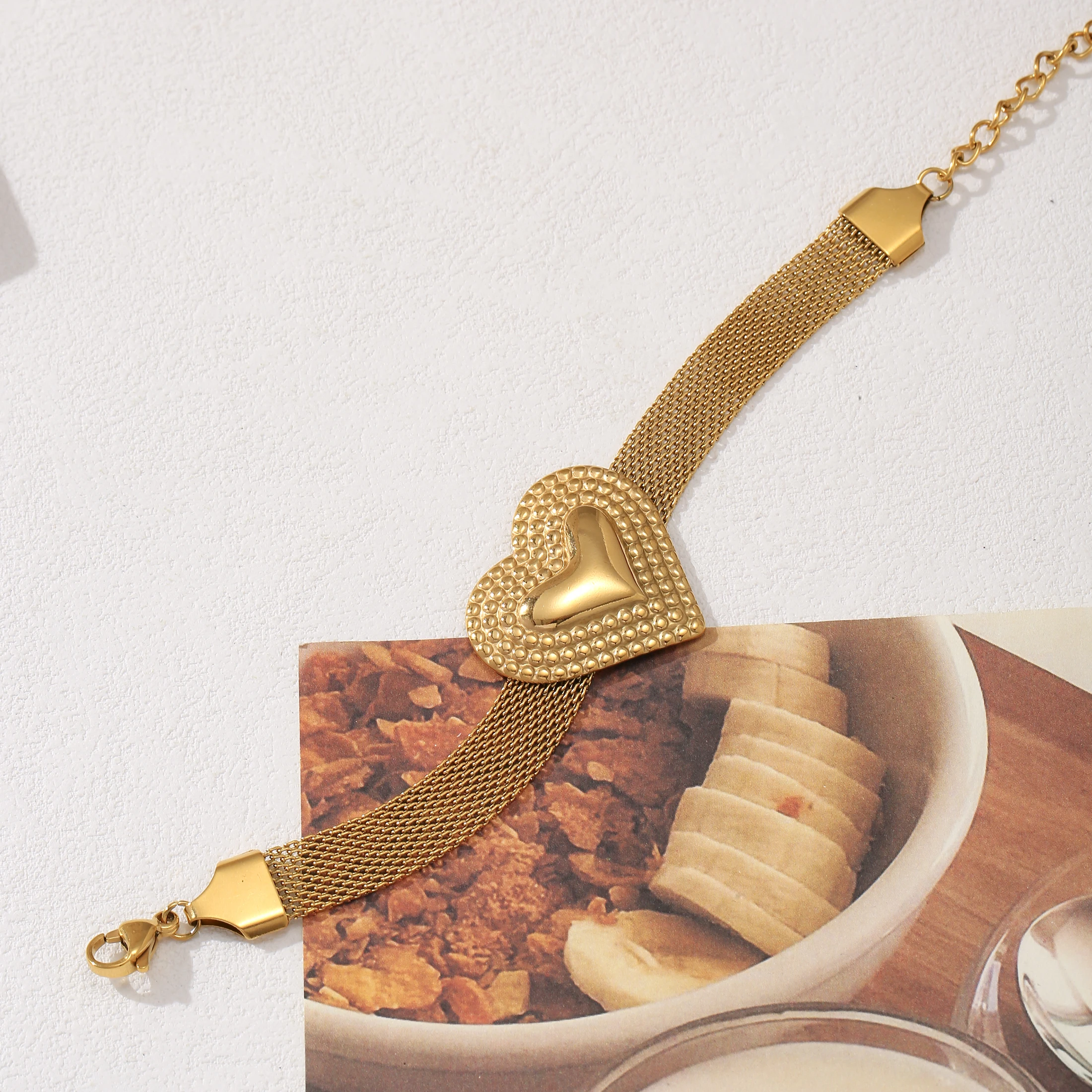 

Golden Tone Stainless Steel Mesh Chain Bracelet with Embossed Heart Charm for Women