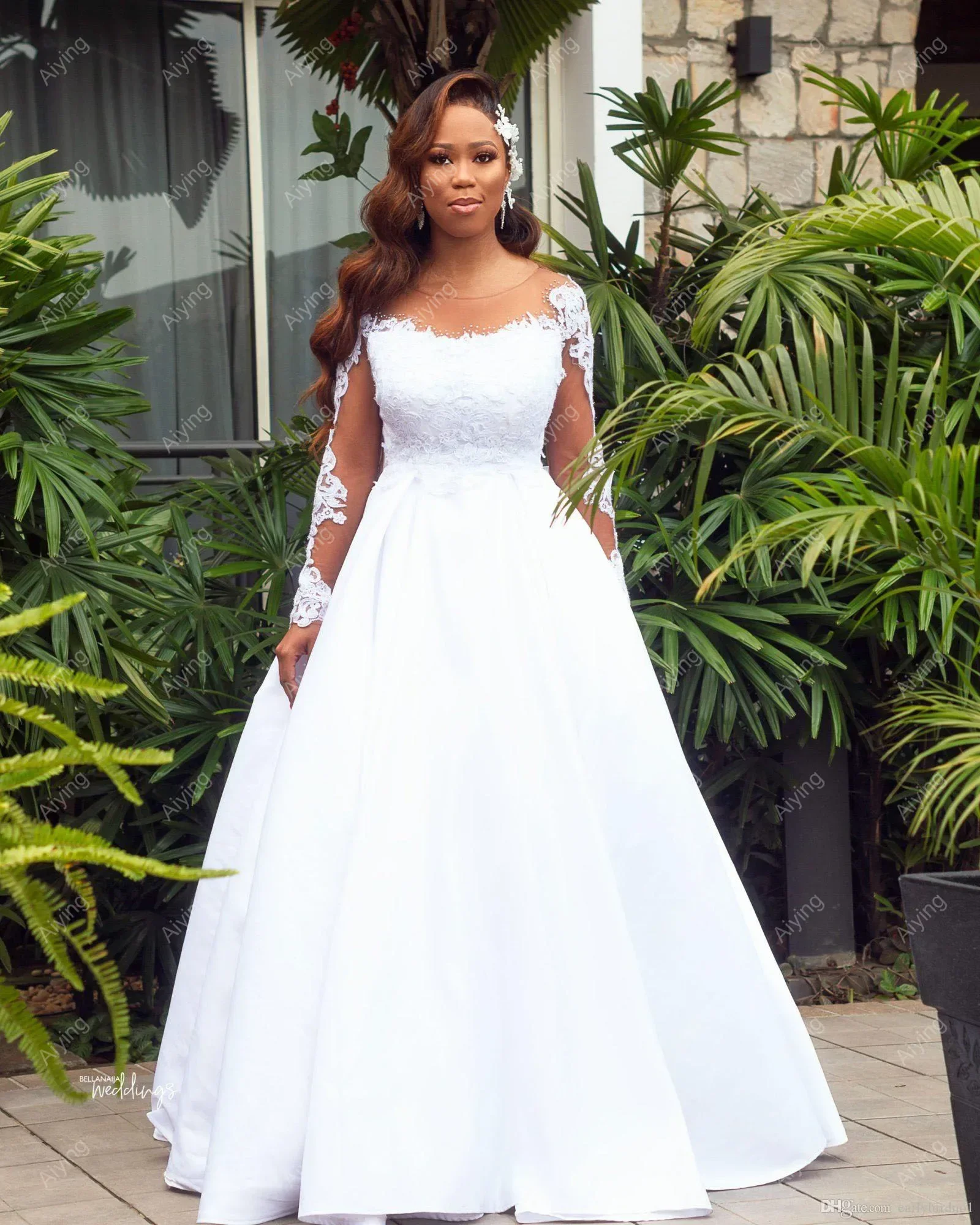 Maßgeschneiderte Spitzenapplikationen A-Linie Brautkleid Hofzug Vestido De Noiva Illusion Lange Ärmel Afrikanisches Brautkleid mit großer Schleife