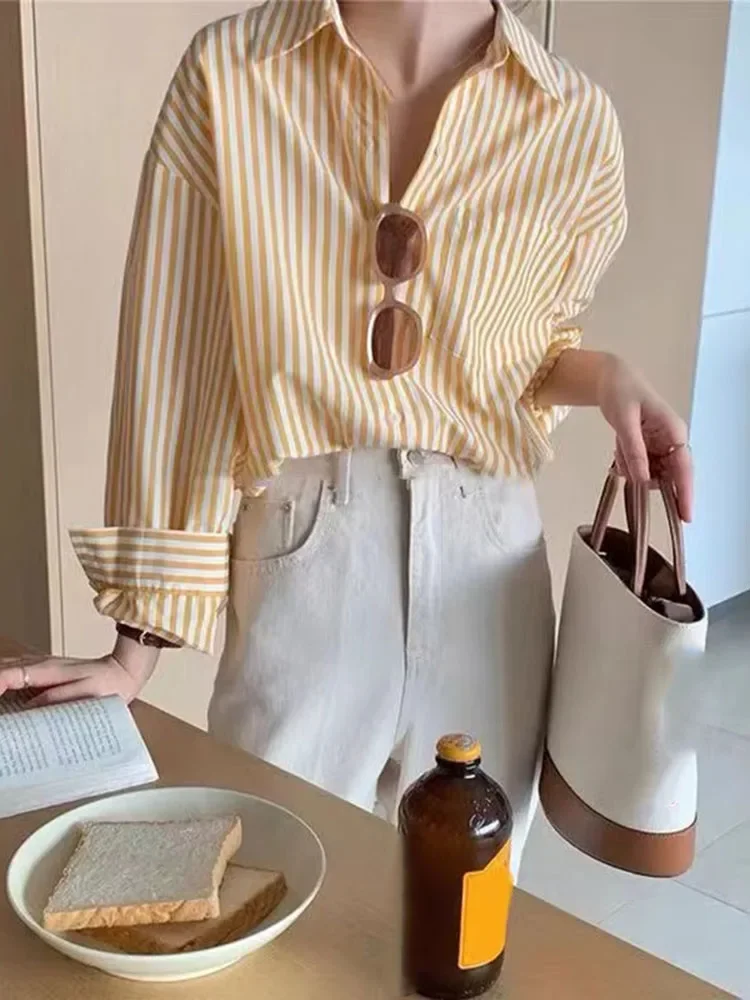 

Свободные рубашки и блузки для женщин. Популярная корейская одежда в полоску. Туника на пуговицах. 2025 г. Модный базовый красивый женский топ с принтом.