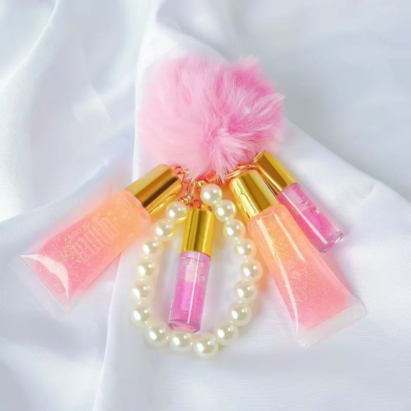 ลิปกลอสเปลี่ยนสีอุ่น 1 ชิ้น พร้อมจี้มุก ลิปออยล์ 3-in-1 สีติดทนนาน ลูกบอลน่ารัก พกพาสะดวก พร้อมกระจก