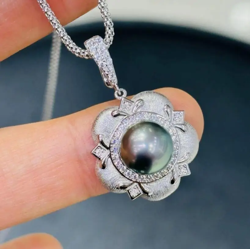 

потрясающий кулон с таитянским круглым черным зеленым жемчугом диаметром 10-11 мм, 925-х годов.