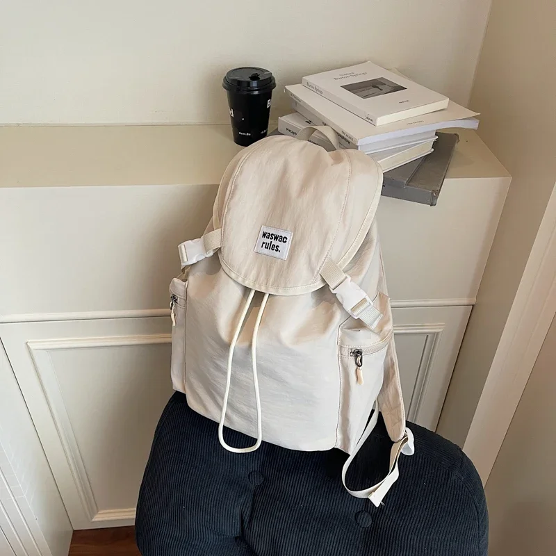 

Однотонный повседневный универсальный рюкзак большой емкости для женщин, 2026, популярный модный свежий простой изысканный портативный школьный рюкзак