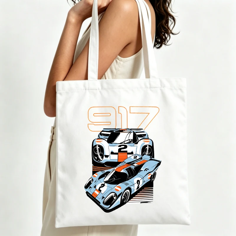 Women's racing car graphic canvas tote bag with typography print, ideal for casual daily use and weekend outings