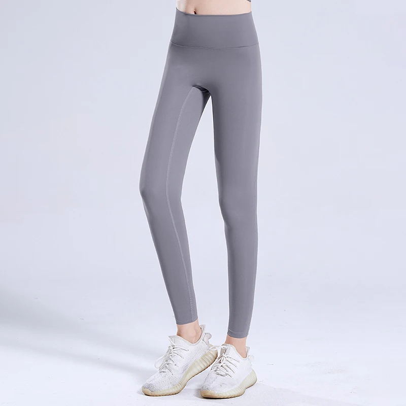 Nuovi pantaloni sportivi ad asciugatura rapida Pantaloni da yoga da corsa attillati Pantaloni da fitness incrociati elasticizzati all'anca color pesca a vita alta da donna