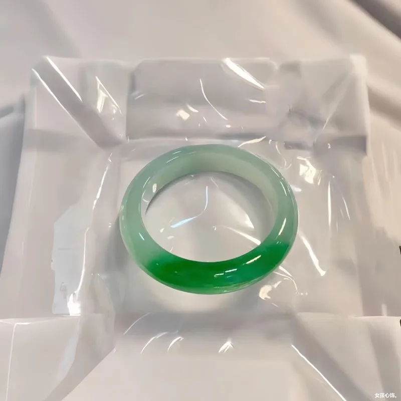Natural ice-type white background with green jade bracelet, genuine Burmese circular jade bracelet with vibrant green jade, a hi