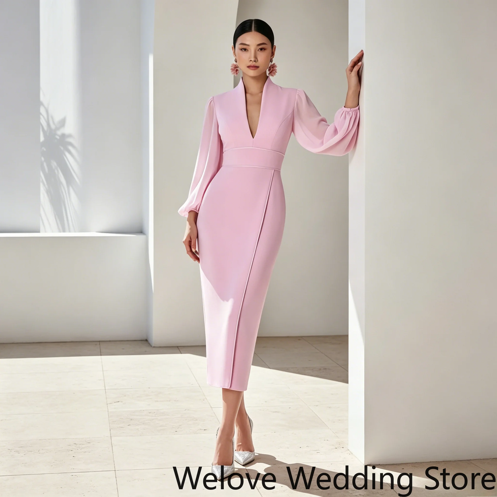 

Pink Formal Midi Dress Featuring deep V-neckline sheer flowy bishop sleeves tailored sheath silhouette with a subtle front slit