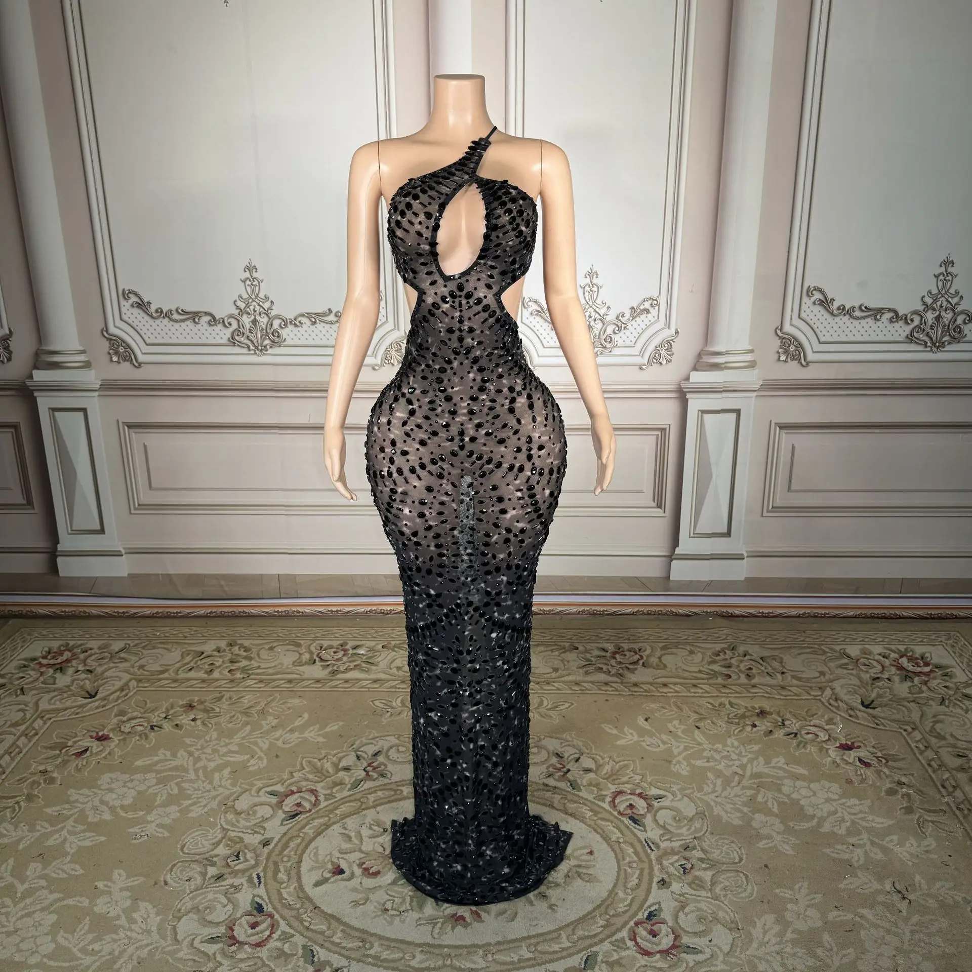 Snake-shaped neckless halter-style revealing dress with luxurious and grandiose style. Evening gown for the host of the company'