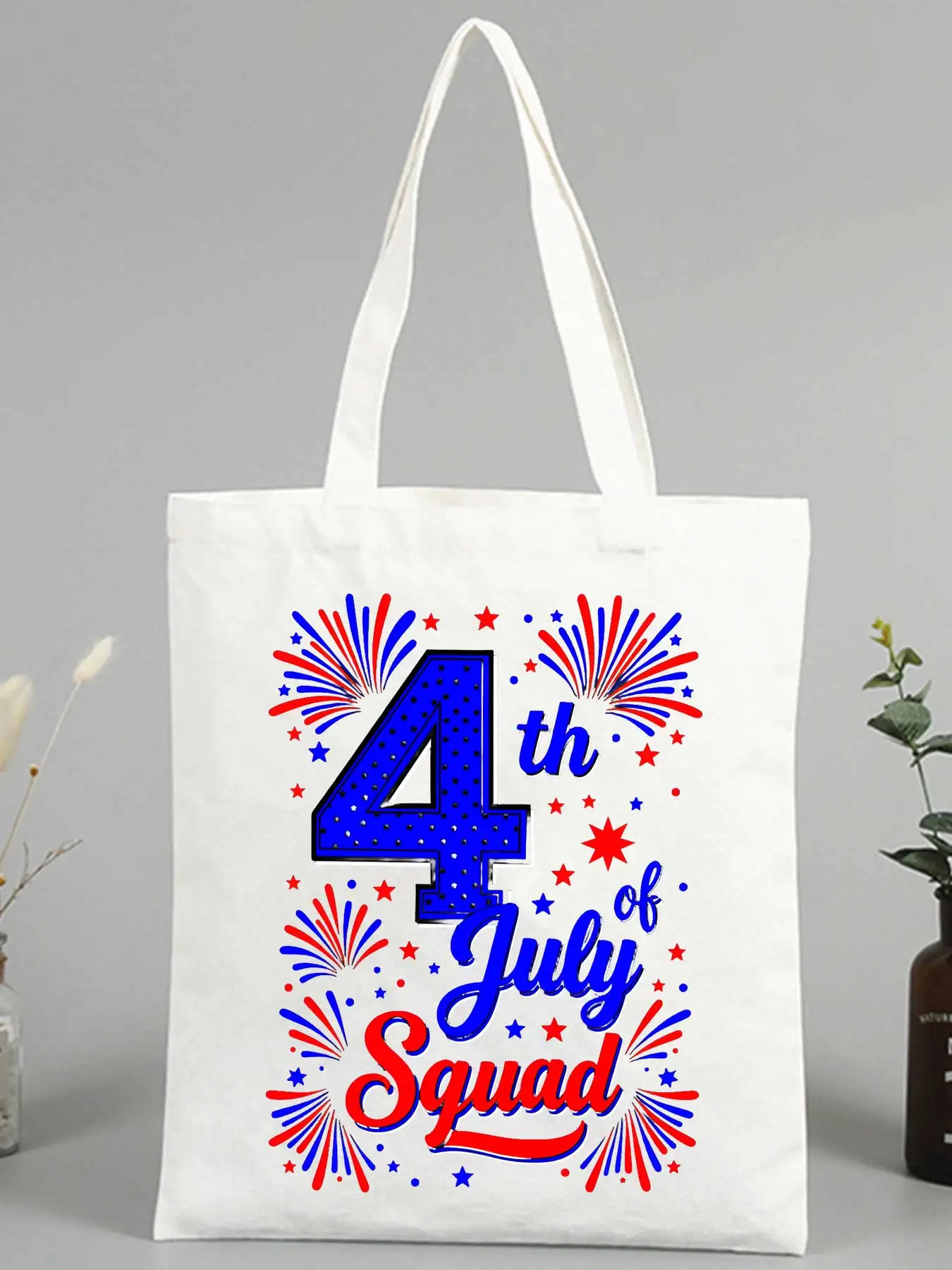 Women's canvas tote bag with 4th of July fireworks and stars print, ideal for summer celebrations and casual outings
