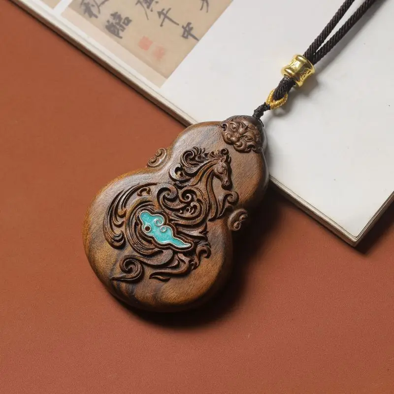 Agarwood pendant with a double-sided carved design of a galloping horse and auspicious clouds, a handcrafted art piece, suitable