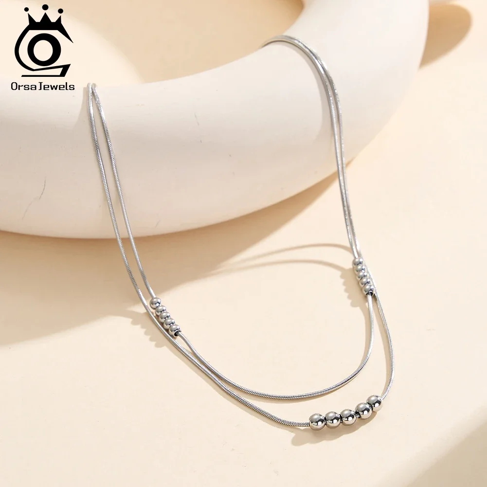 

ORSA JEWELS Stainless Steel Double Layered Round Pendant Necklace for Women Fashion Simple Beaded Chain Party Jewelry STCC04