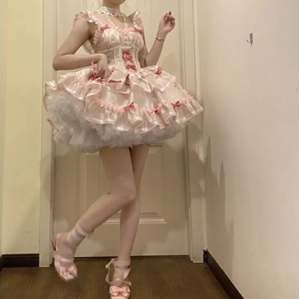 Vestido de verano estilo Lolita, con escote corazón, de la marca Ballet Jsk, en color rosa, negro y lila, con mangas abullonadas y un lazo decorativo, ideal como disfraz para niñas.