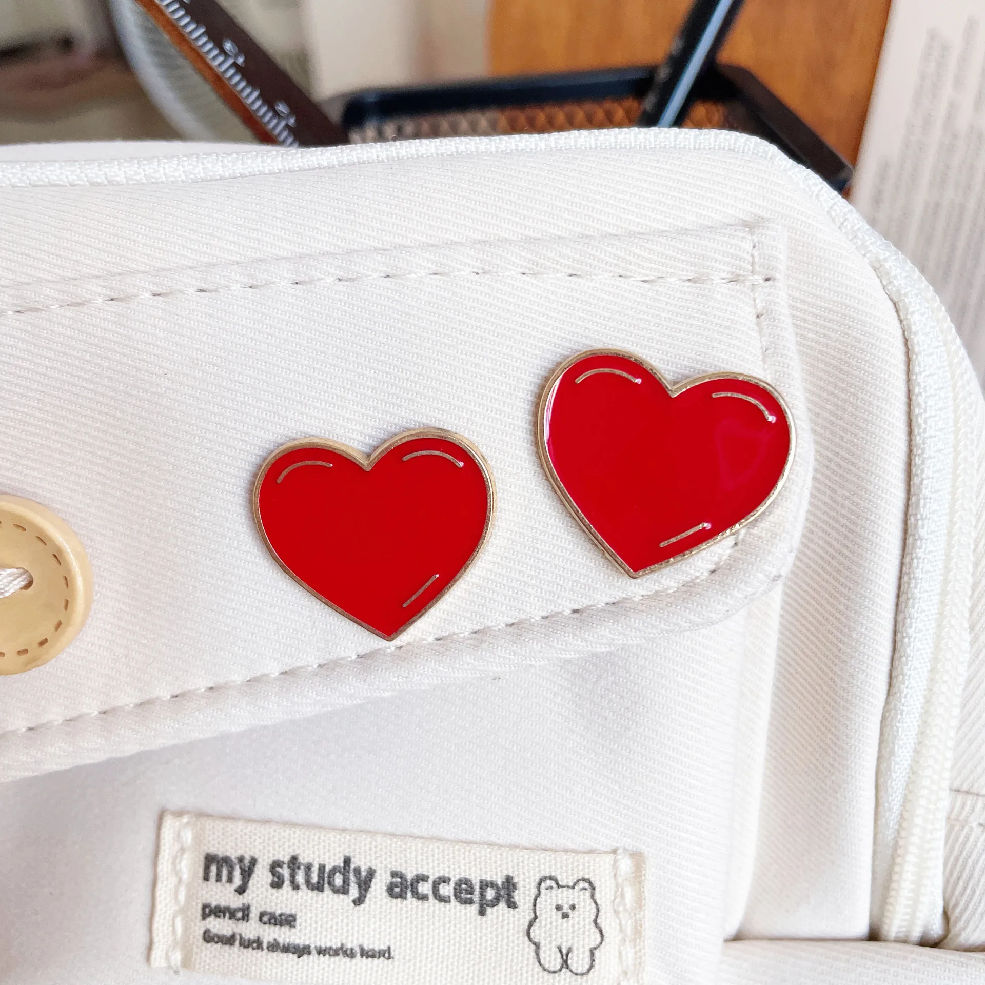 

Red heart-shaped brooch metal badge