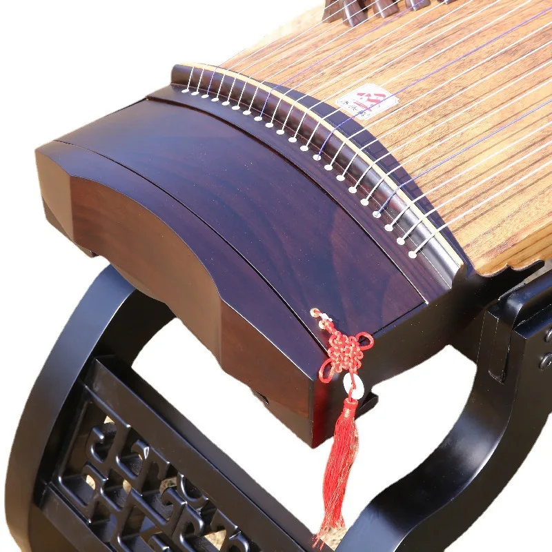 Professional playing Guzheng, classical plucked musical instrument