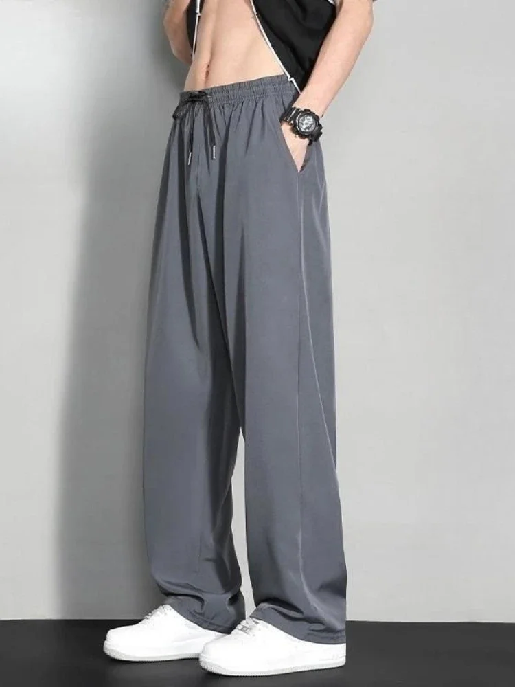 GELITAYIN ฤดูร้อนผ้าไหมน้ำแข็งสีทึบสบายๆกางเกงขากว้างผู้ชายคลาสสิกหลวมสตรีทแวร์สไตล์เกาหลี Xxxl ขายกางเกงดีไซเนอร์