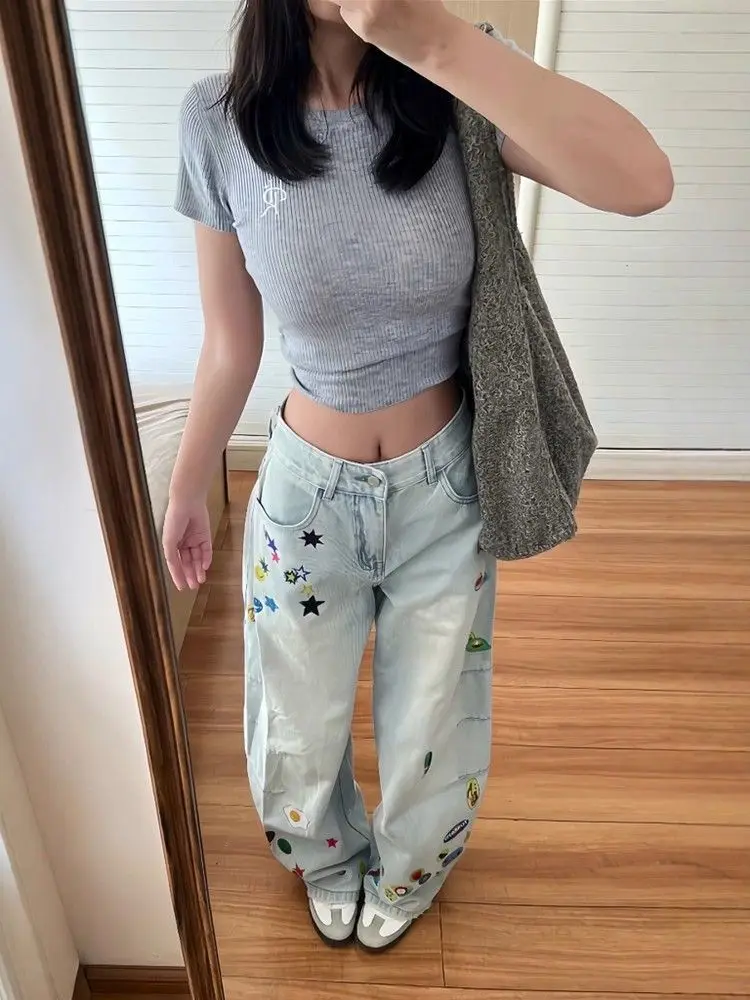กางเกงยีนส์ทรงหลวมพิมพ์ลายการ์ตูนสีน้ำเงินวินเทจ สไตล์ Y2K สำหรับผู้หญิง ฤดูใบไม้ร่วง 2025 สไตล์ฮาราจูกุ ขากว้าง เอวสูงทรงโอเวอร์ไซส์ ยุค 2000