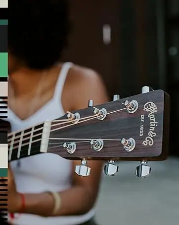 A person holding a guitar. Text reads: Appreciate the unbeatable tone of a Martin.