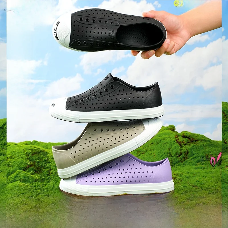 

Women's Classic Black White Slip-On Sandals Anti-Slip Garden Beach Jelly Shoes Happy Hole Design Comfortable Spring Season