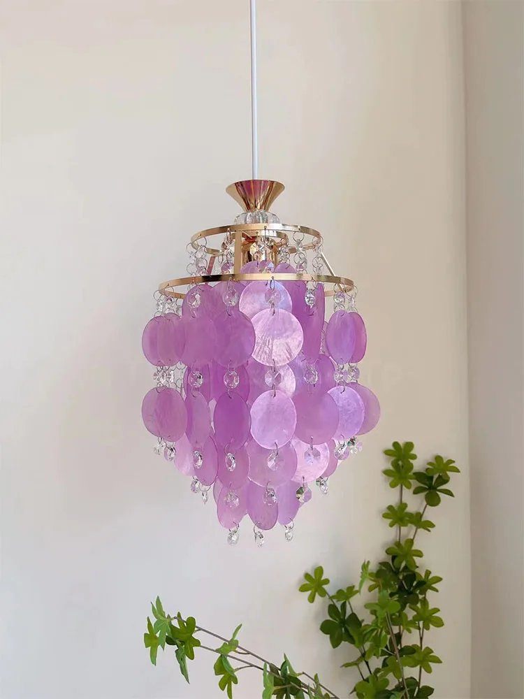 Colorful seashells, wind chimes, crystal chandeliers, balconies, foyer, kitchen, and restaurant