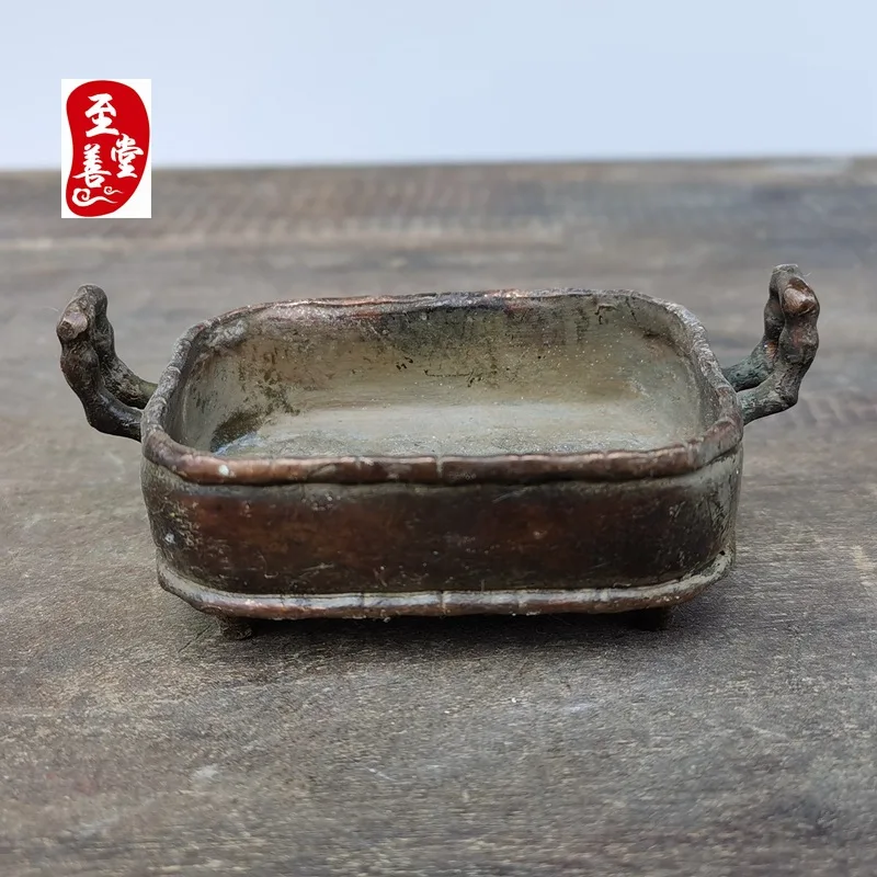 Antique-style copper alloy incense burner with a patina effect, featuring a double-eared, four-legged, square design, suitable f