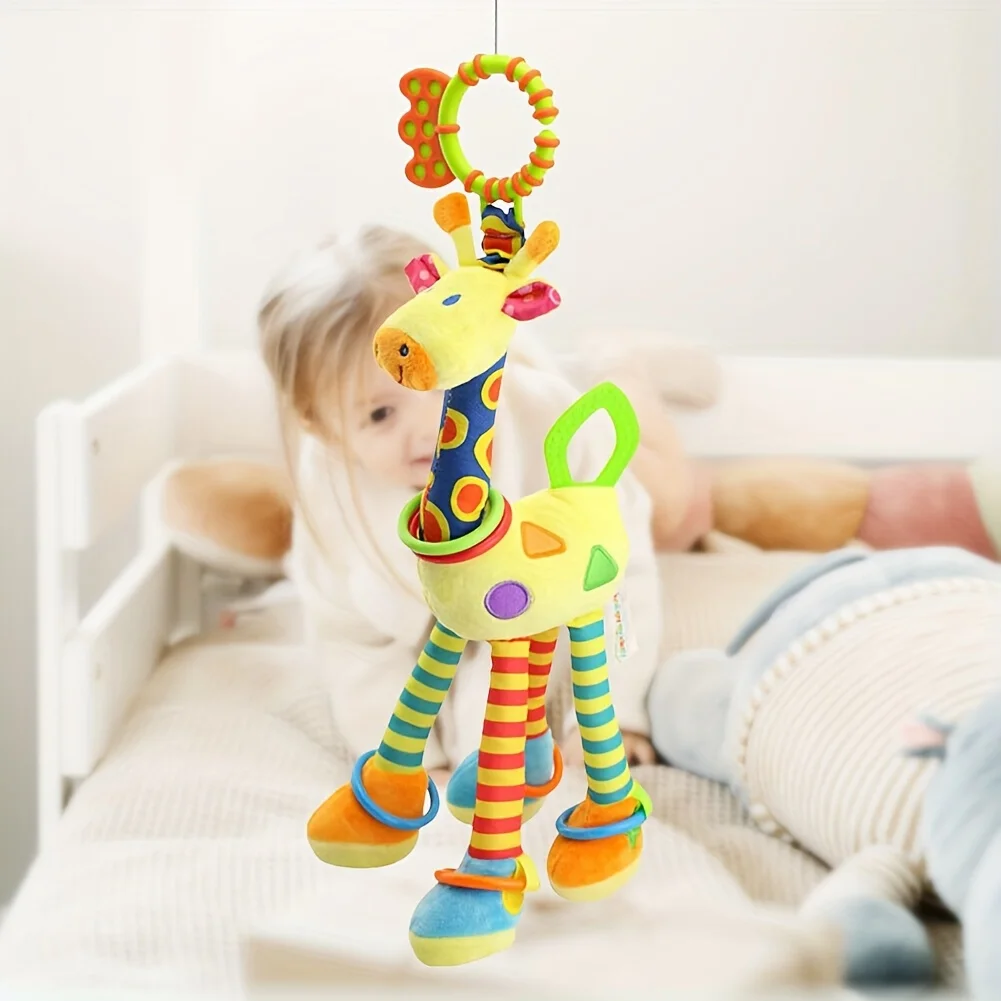 

Adorable Plush Giraffe Hanging Toy - Makes Percussive Bells - Fits Strollers, Seats and Cribs - Stimulates Sensory Development