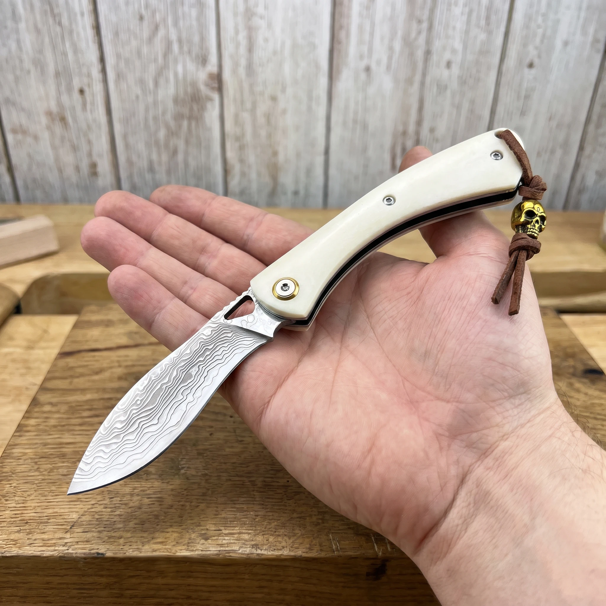 Stunning Damascus Folding Knife with Creamy Ivory Handle Leather Lanyard Golden Skull Ornament Camping Hiking Outdoor EDC Carry