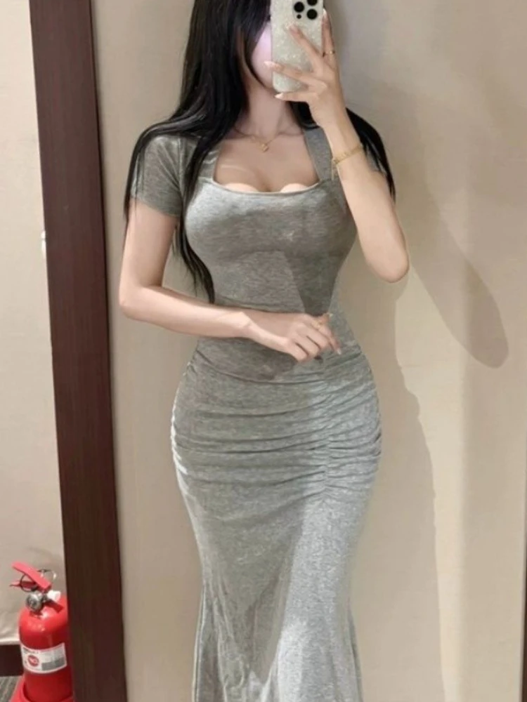 Venta al por mayor, vestidos lisos, vestido ajustado elástico elegante de verano para mujer, vestido largo de manga corta para vacaciones juveniles elegantes de calle para mujer