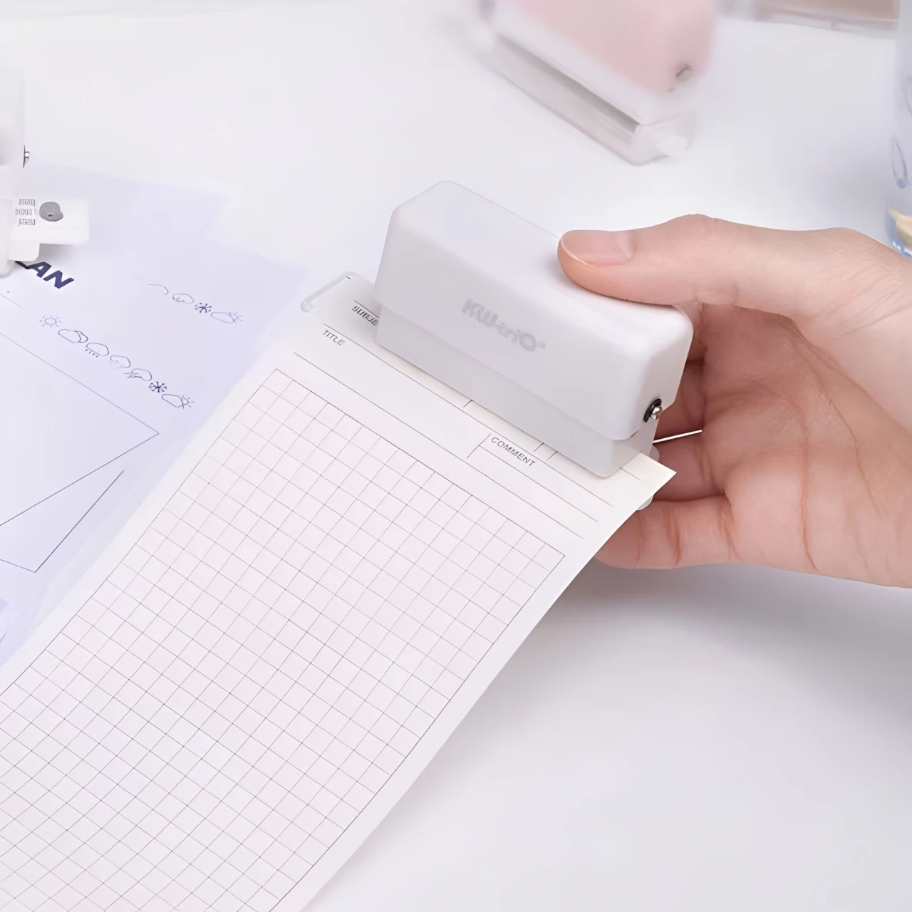 1PC portable multi-function 6-hole punch, mini handheld with built-in ruler and scrap container, suitable for DIY crafts.