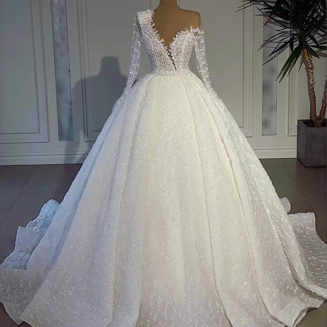 

Customized Luxurious White A Line 3D Lace Bead Decoration Wedding Dress Sexy Transparent Collar Long Sleeve Ball Bridal Dress