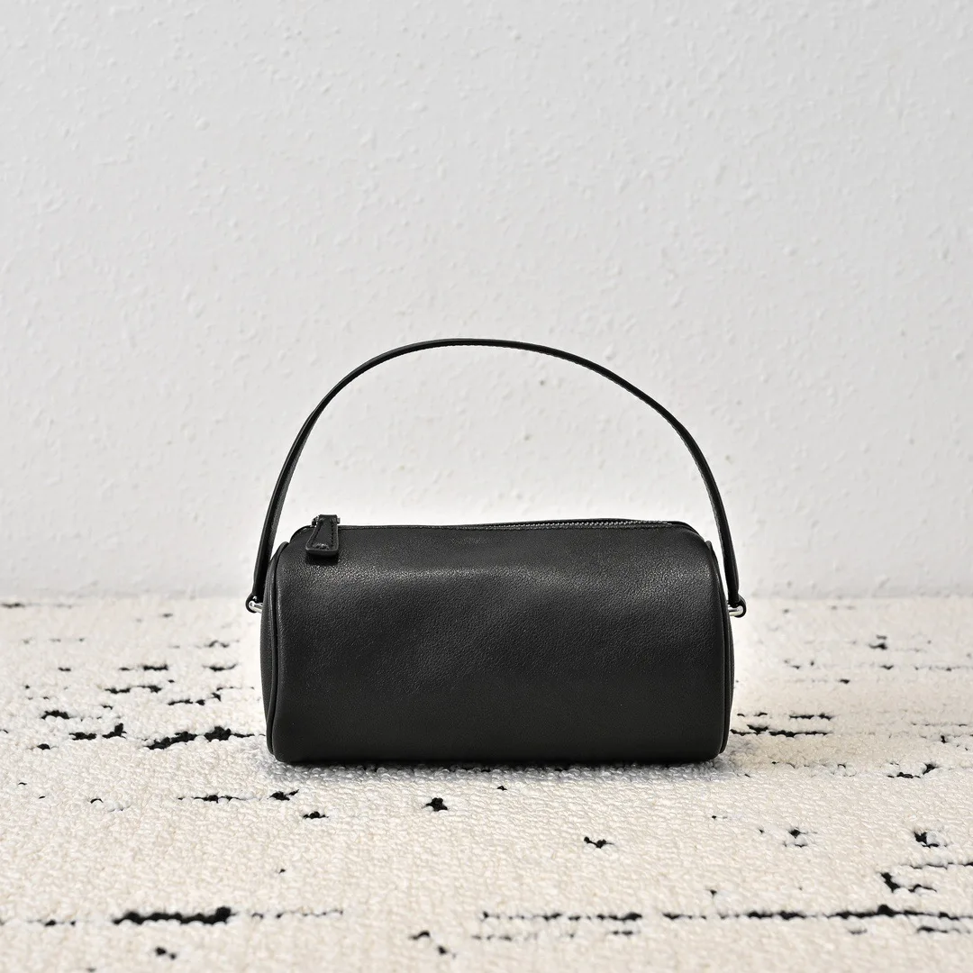 

2025 women top quality Mini round bag made of cowhide leather, portable and casual women's bag, retro and simple style.