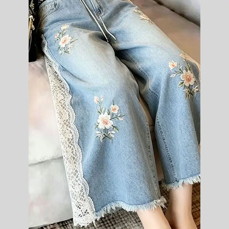 2026 summer women vintage floral pattern lace patchwork ripped tassel wide leg denim pants , woman casual jeans trousers
