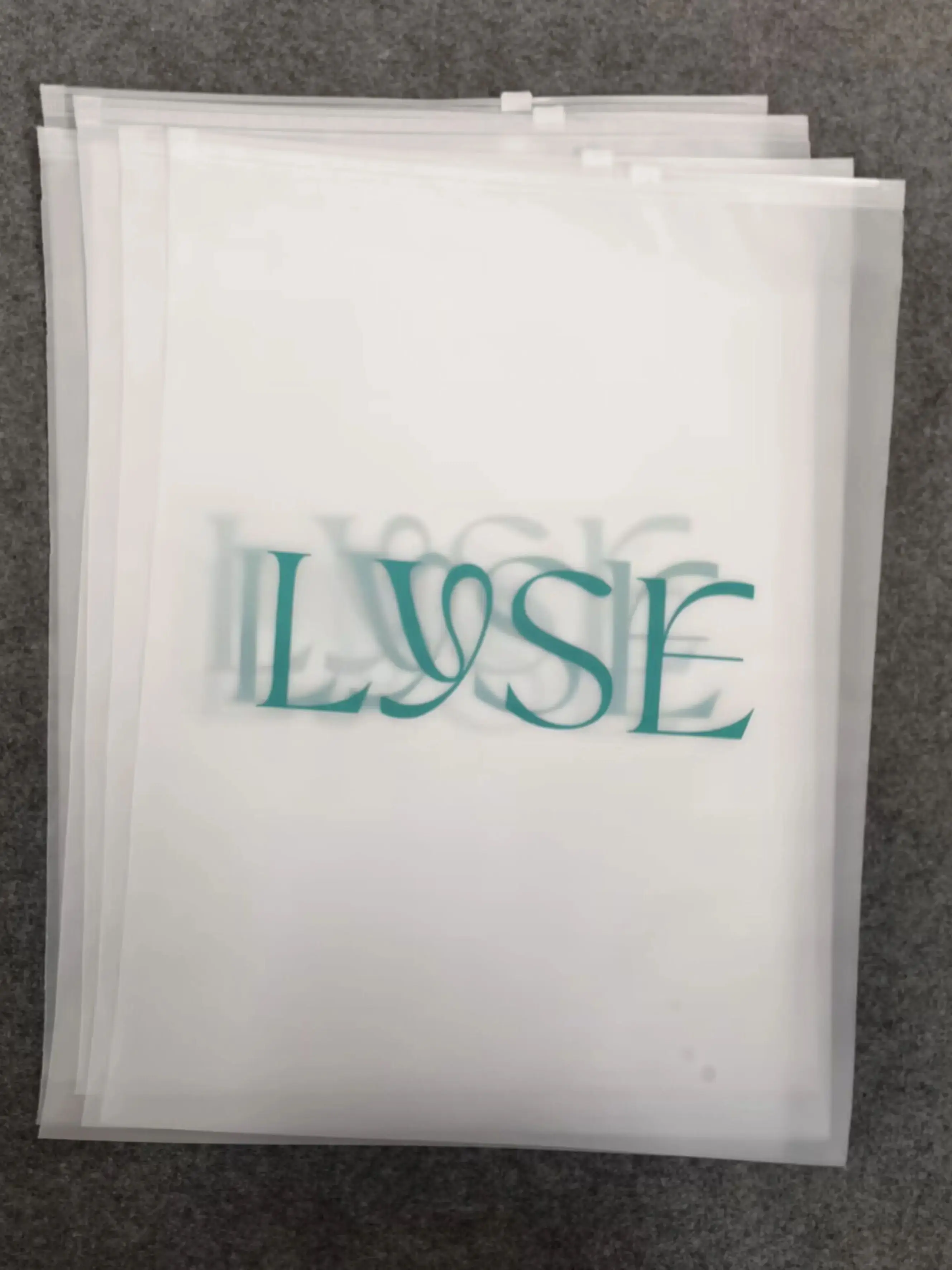 High quality customize apparel bags frosted ziplock plastic pouch with suffocation warning label for apparel packaging bags