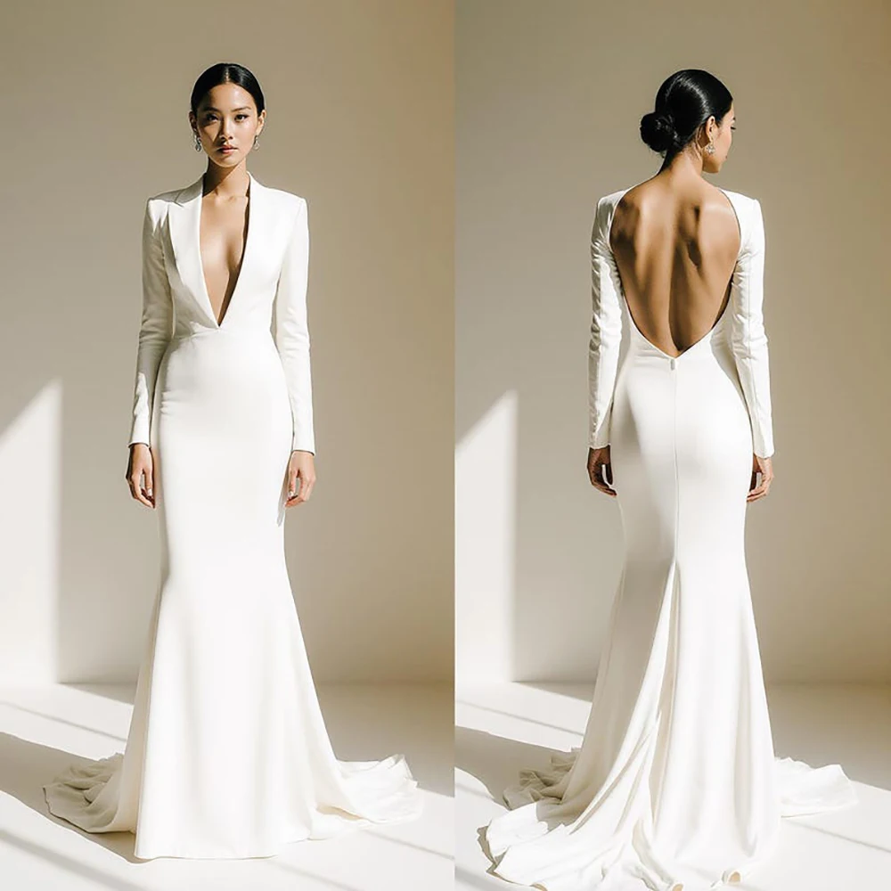 

Minimalist Long Sleeve Wedding Dresses 2026 Deep Plunging Blazer Neckline Dramatic Open Back Modern Elegant Bridal Gown