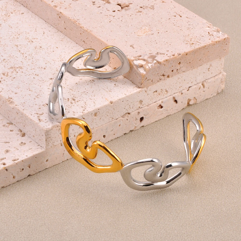 JeeMango Unregelmäßige Hohle Geometrische Edelstahl Offene Armreifen für Frau Vintage Trendy Gold Überzogene Wasserdichte Schmuck B25169