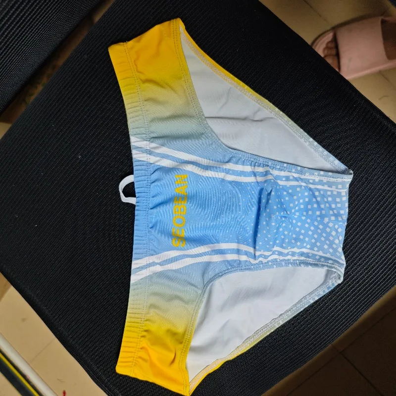 

2026 Fashion Summer color classic new men's triangular printed men's swimming trunks wholesale F250901