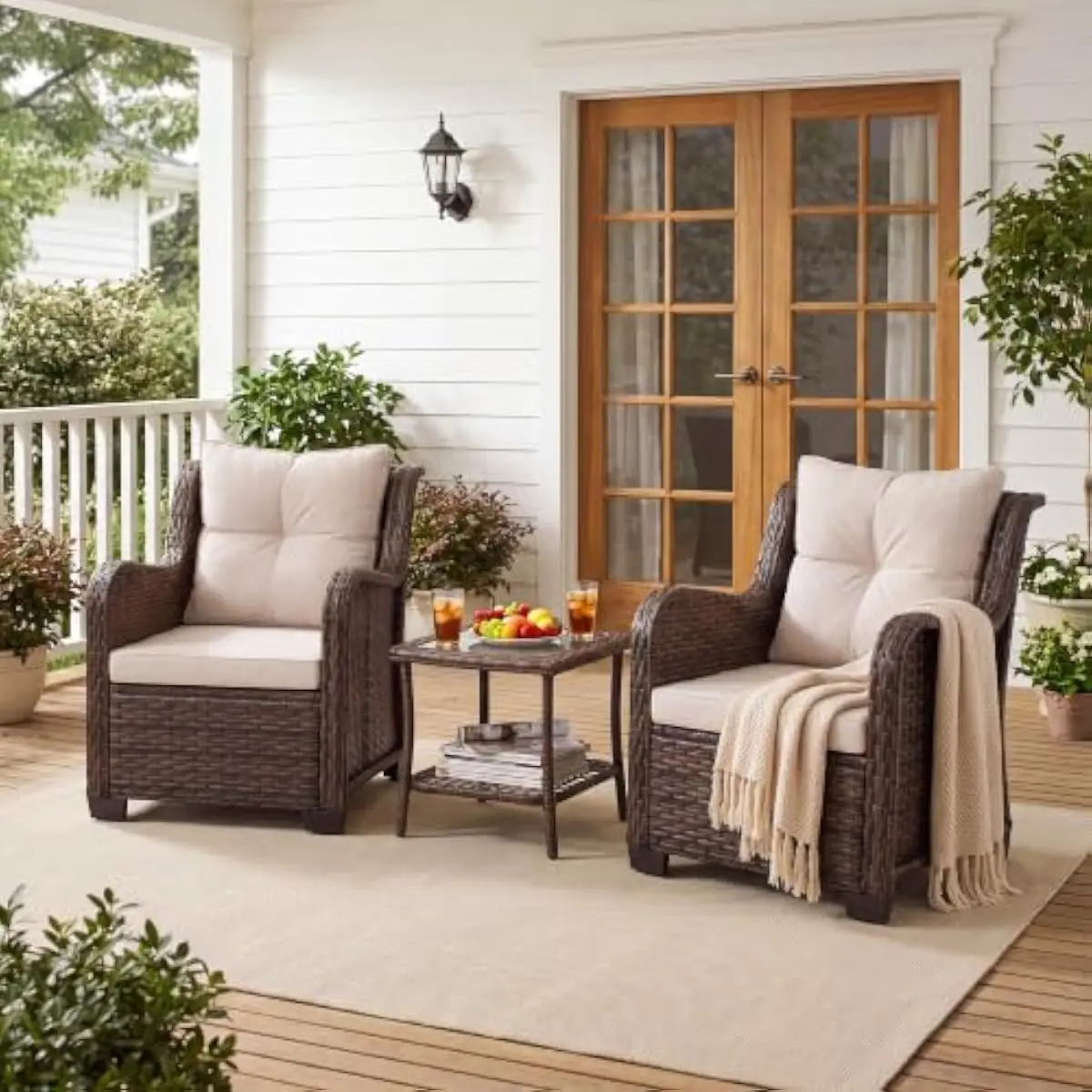 3-piece outdoor seating ensemble featuring beige PE rattan armchairs with high backrests and plush cushions plus rectangular tem