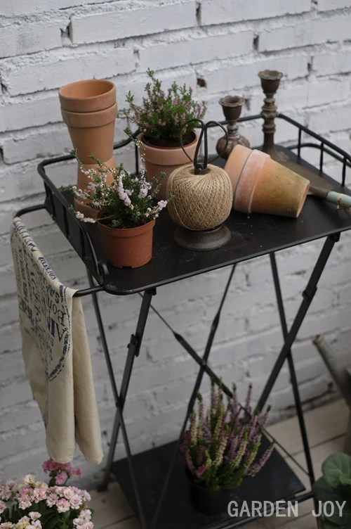 Old style wrought iron flower stand, console