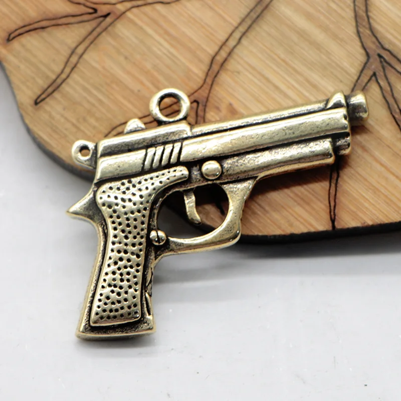 Metal brass carved three-dimensional pistol model car key chain pendant small copper pendant retro luggage accessories pendant