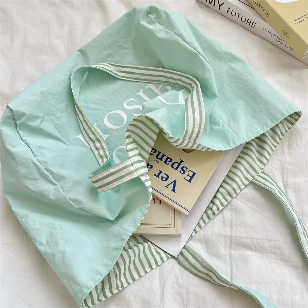 Sac fourre-tout double face Dopamine, trousse de maquillage pour rouge à lèvres, sac de voyage décontracté à bandoulière simple, sac de rangement pour lettres colorées rayées