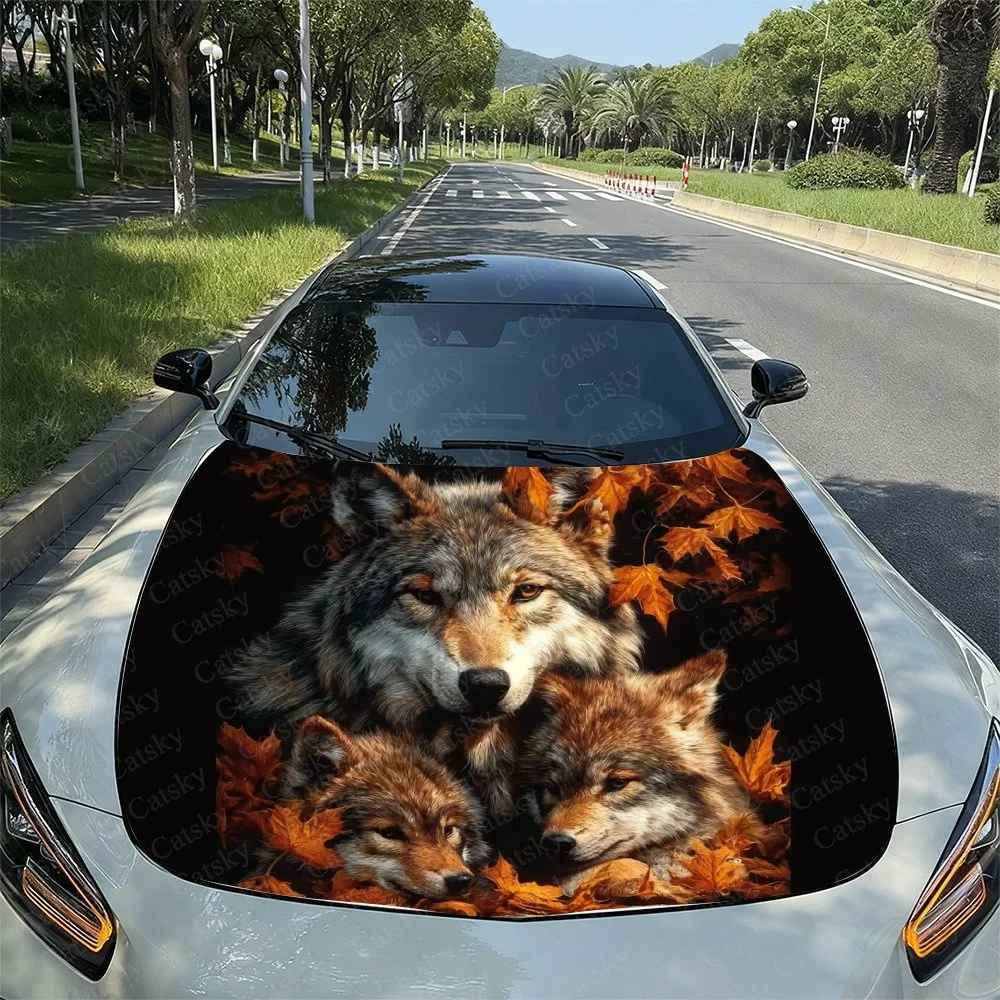 This car hood features a stunning 3D design of three wolves amidst autumn leaves, creating a vivid and eye-catching visual effec