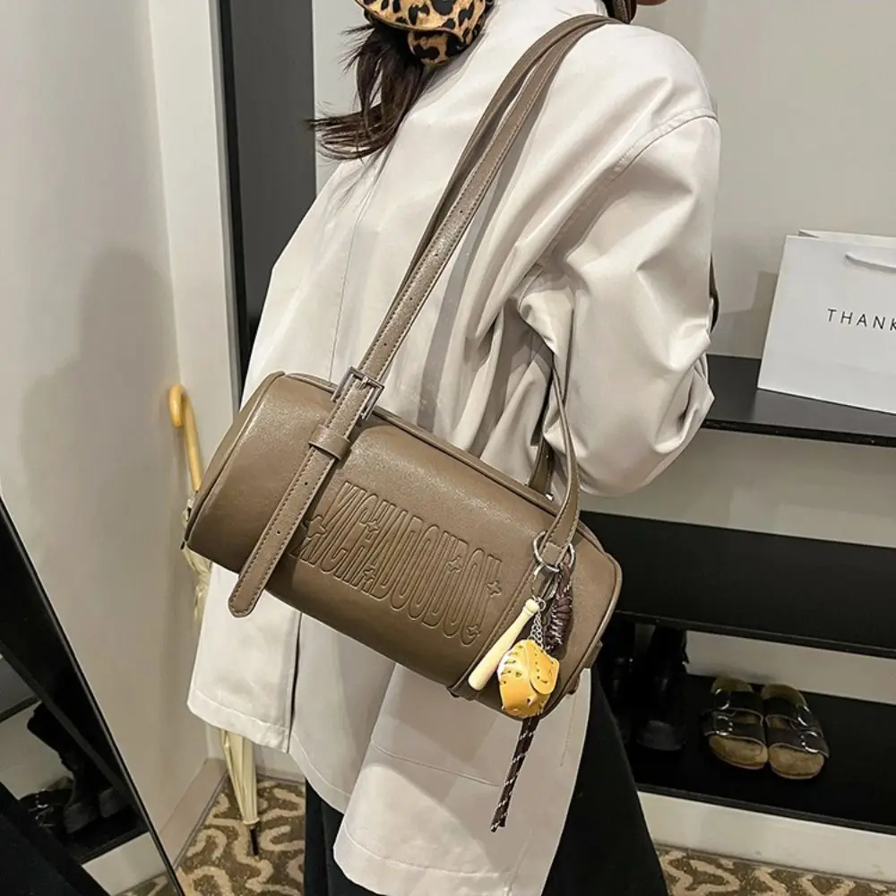 Latest Designer Cylinder Shaped Shoulder Bag With Pendant Solid Color Crossbody Bag Multifunctional Women Backpack