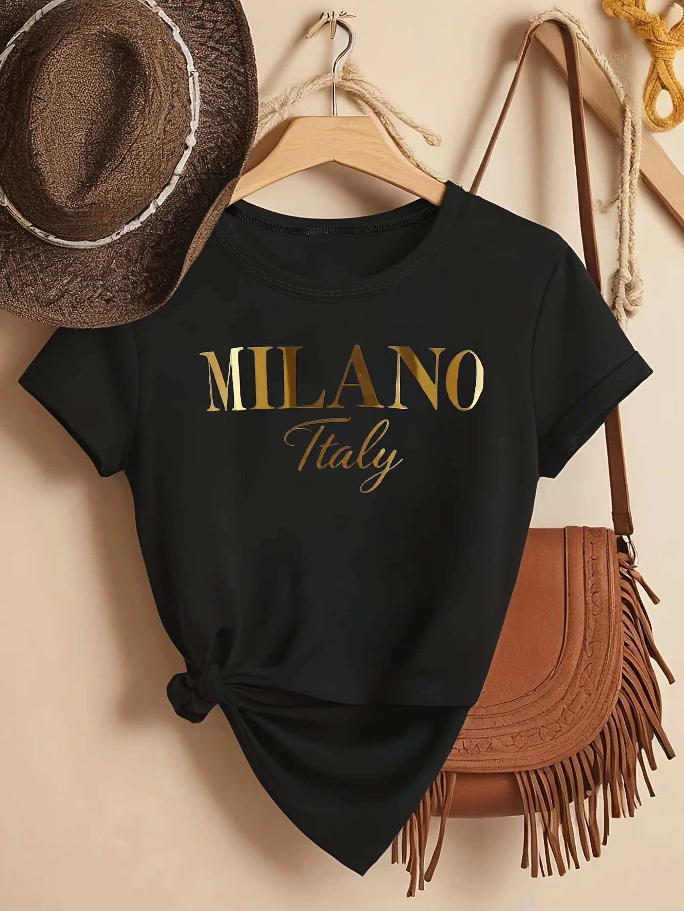 This Women Fashion Short Sleeve Top Features an Elegant Design with a Golden Uppercase MILANO Print Embodying a Minimalist Style