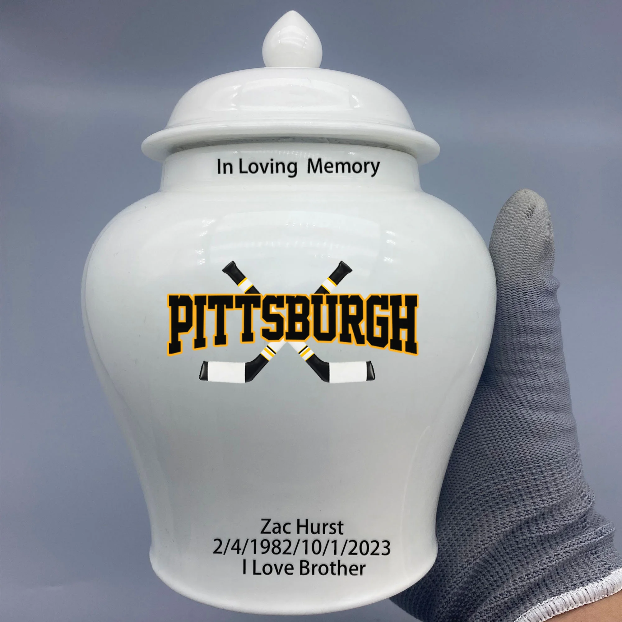 Medium Urn for Pittsburgh Penguins-themed Hockey Urn.Please send me the customize information-name/date and number on the urn