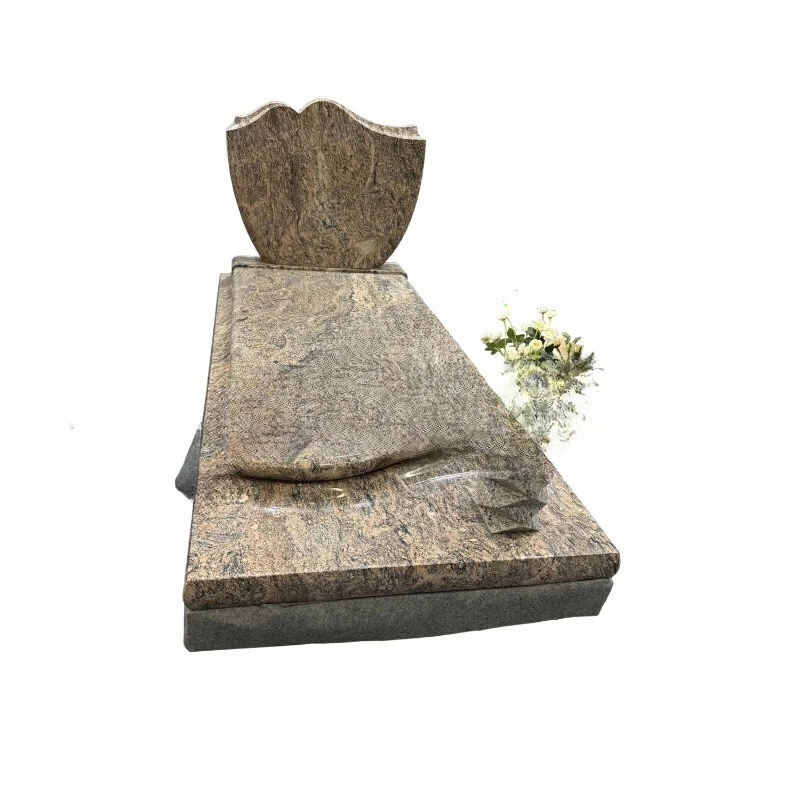 Granite headstone with angel sculpture and rose sculpture