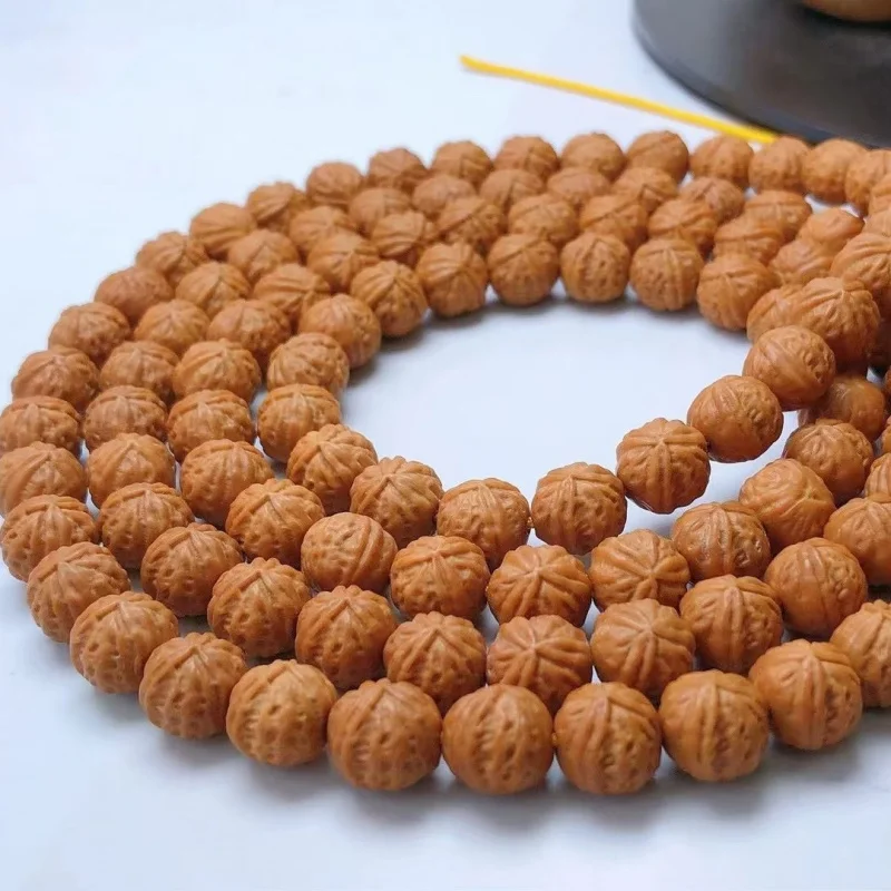 All-natural triangular small , 108 long strands, monkey head walnuts for hanging around the neck, large quant