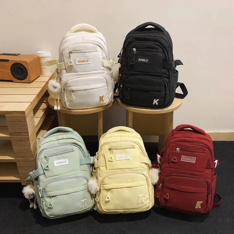 Name:A Stylish Cute Lightweight Backpack Solid Color Multi-pockets For Work Commuting Student School Bag With A Pendant