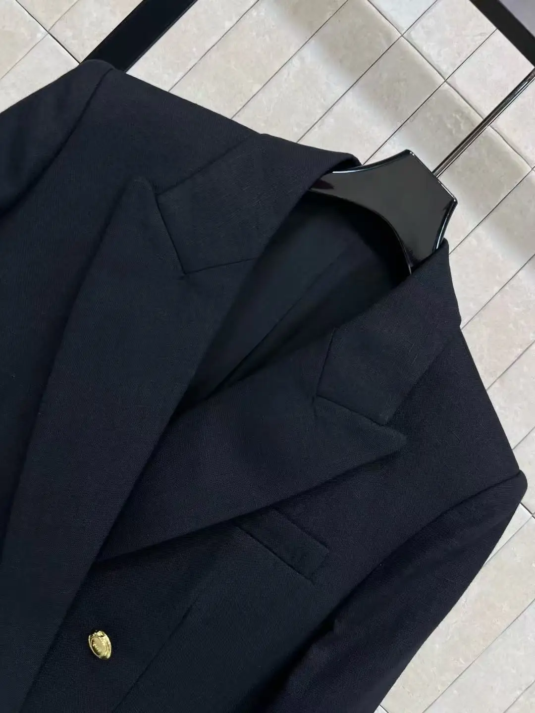 Luxurious slimming waist design for professional wear. Double metal buttons black suit. Business coat with elegant style.