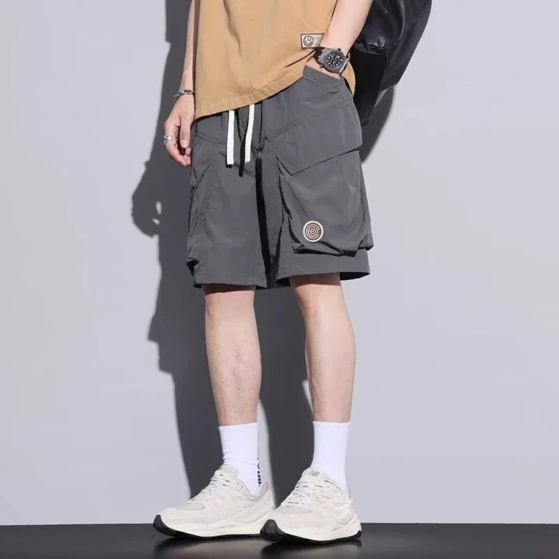 

С застежкой-молнией на шнурке, однотонные эластичные карманы на талии, широкие короткие брюки для мужчин, мужские шорты-карго, мешковатые свободные винтажные новые эластичные брюки