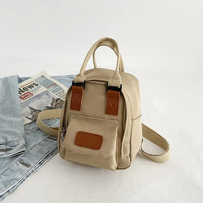 Mini Mochila pequeña coreana para mujer, bolso de lona para chica adolescente, bolso de hombro para teléfono, monedero femenino, nueva tendencia de moda