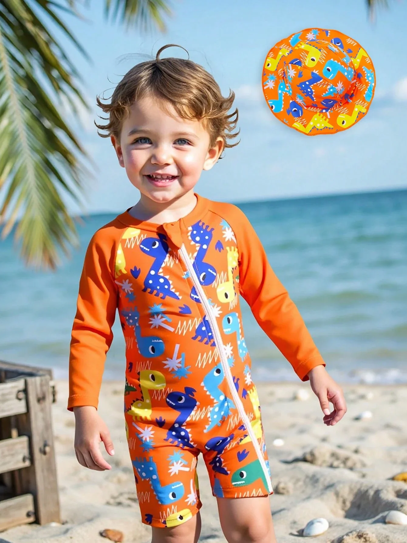 

Оранжевый комплект с принтом динозавра: лонгслив на молнии с длинными рукавами и шляпа от солнца для пляжных и водных видов спорта