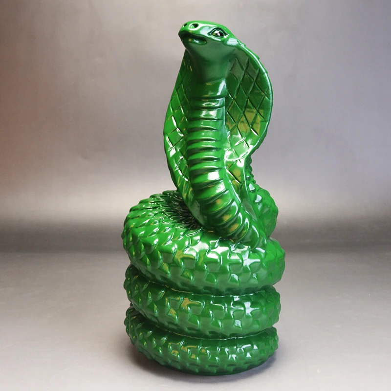 green wood carving snake ornament